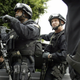 FBI agents in riot gear.